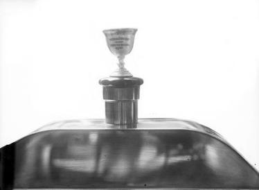 Five Locomobiles with Vanderbilt Cup Mascots